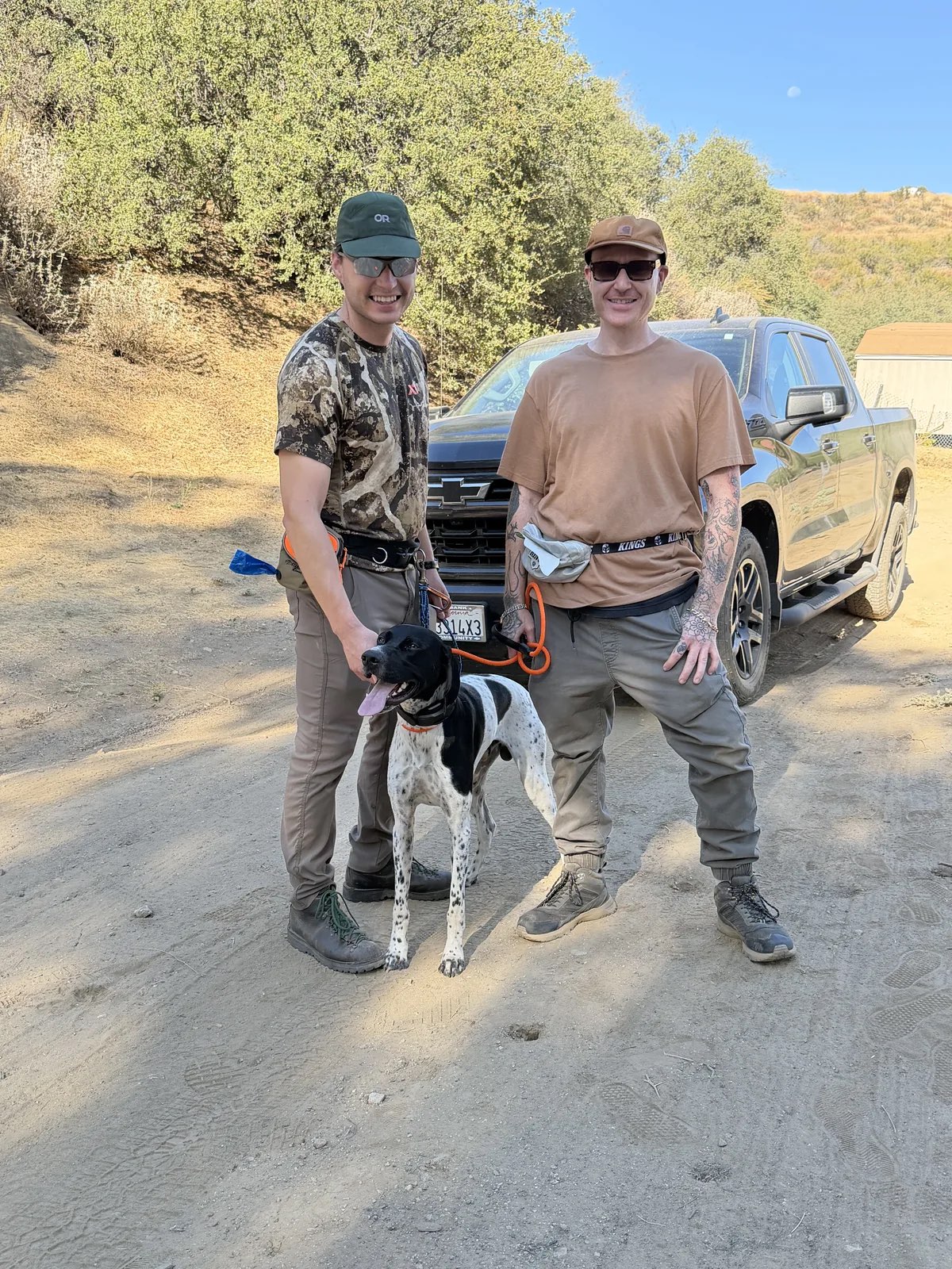 Scott Quashen with a hunter and his pointer during rattlesnake avoidance training