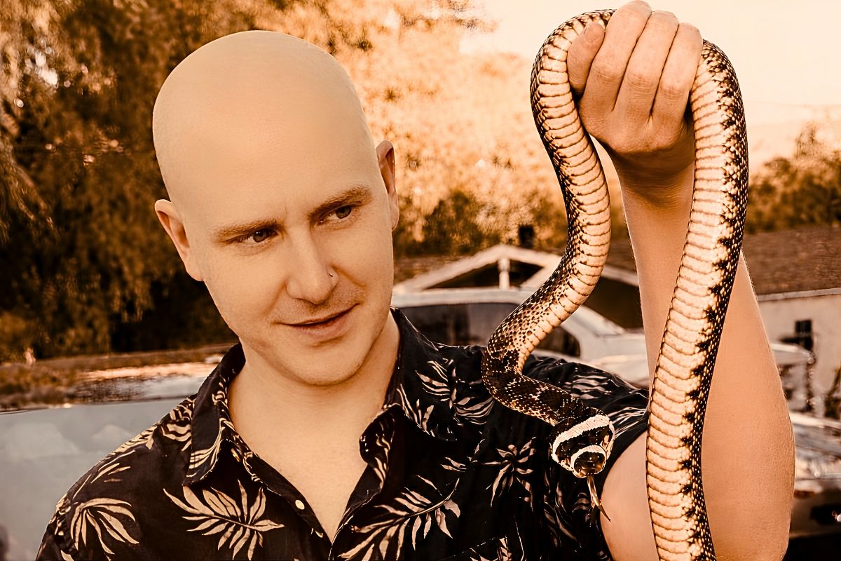 Scott Quashen — The Snake School founder with a rattlesnake