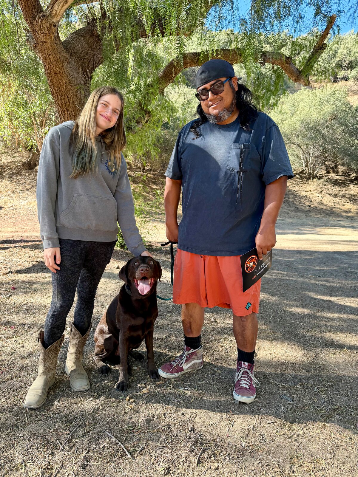 Snake School staff member Helena with a client and their dog